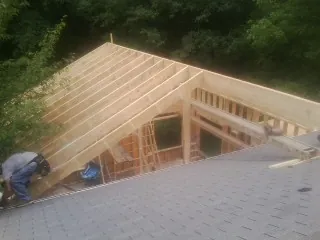 Framing a new roof addition that ties into an existing shingle roof in Ixonia